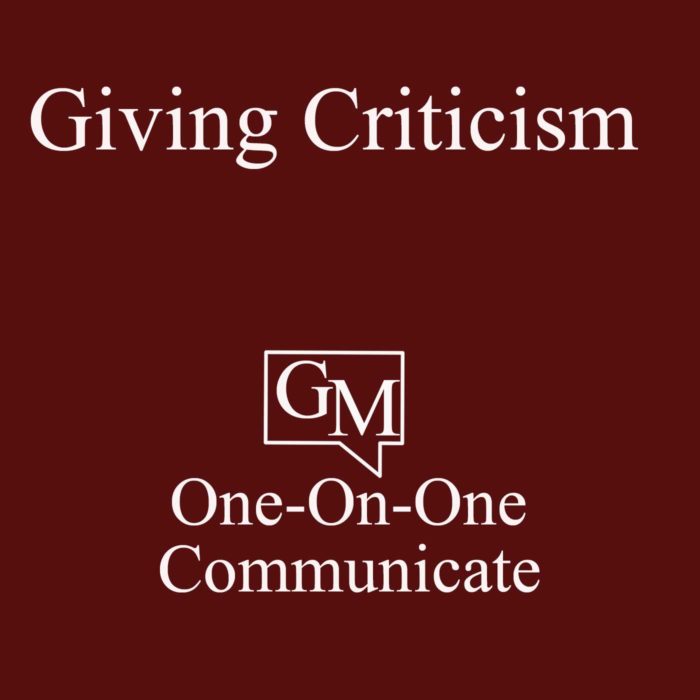 Red graphic white letters, it says Giving Criticism, GM One-On-One Communicate