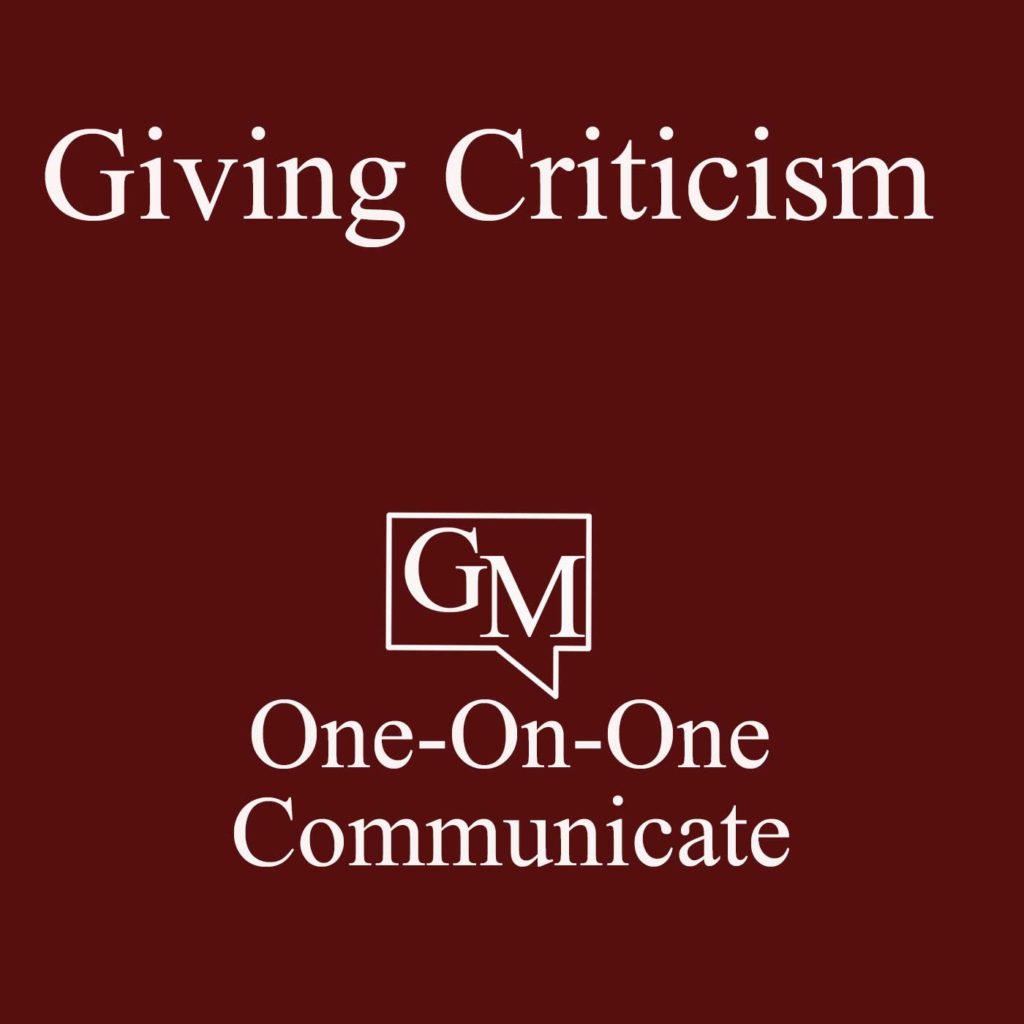 Giving Criticism are the top words, dark red background, white letters, GM logo, One-On-One Communicate