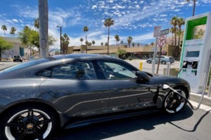 Grey car being charged at a public Electric Vehicle Charging Station