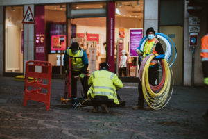 Workers Installing fiber optic cables for Broadband.