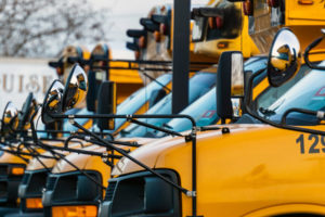 Yellow, new, school buses lined up.