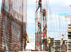 Workers at a Construction Site, climbing bars.